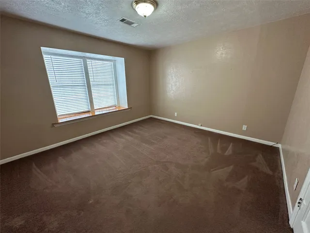 a bathroom with a tub and a shower