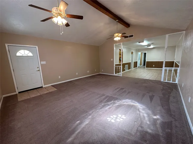 a view of a livingroom with a ceiling fan