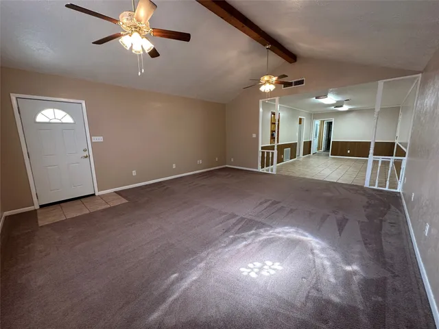 a view of a hallway with stairs