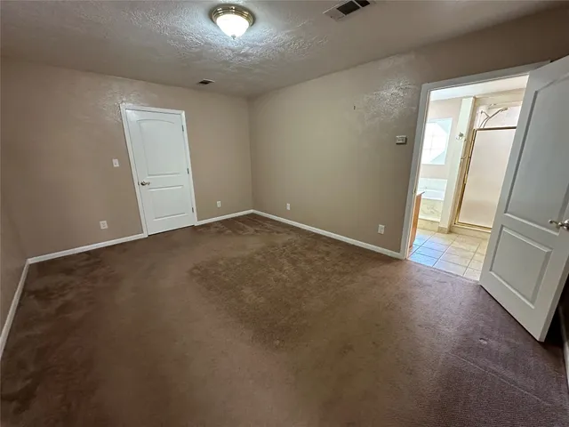 a kitchen with stainless steel appliances granite countertop a refrigerator a stove a sink and dishwasher