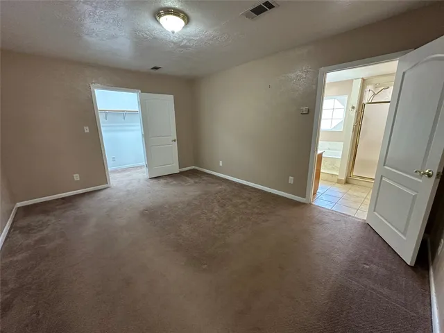 a view of an empty walk in closet