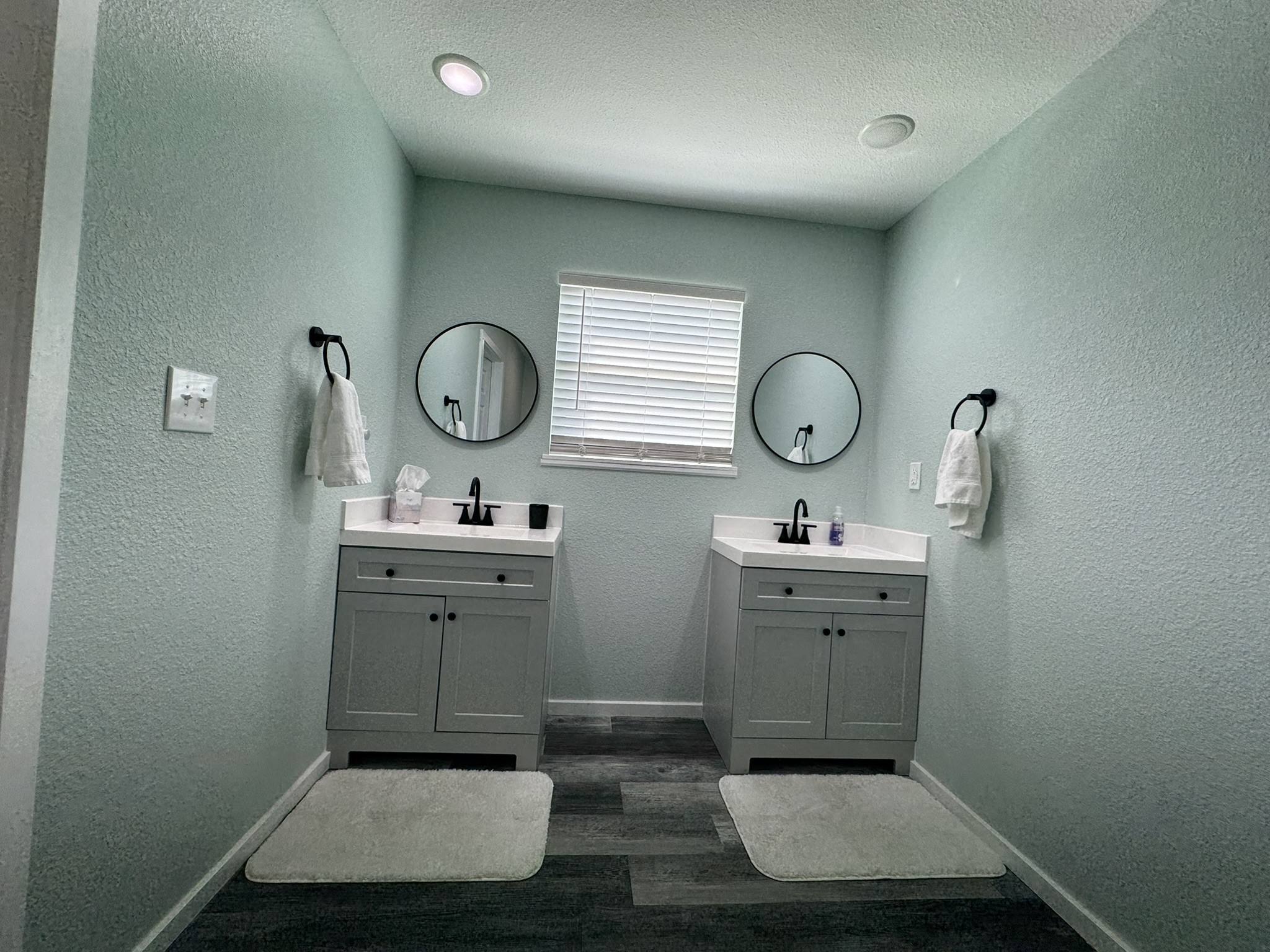 1118 County Road 204 Sargent, TX 77414 - Photo 16 of 36 a bathroom with a toilet sink vanity and mirror