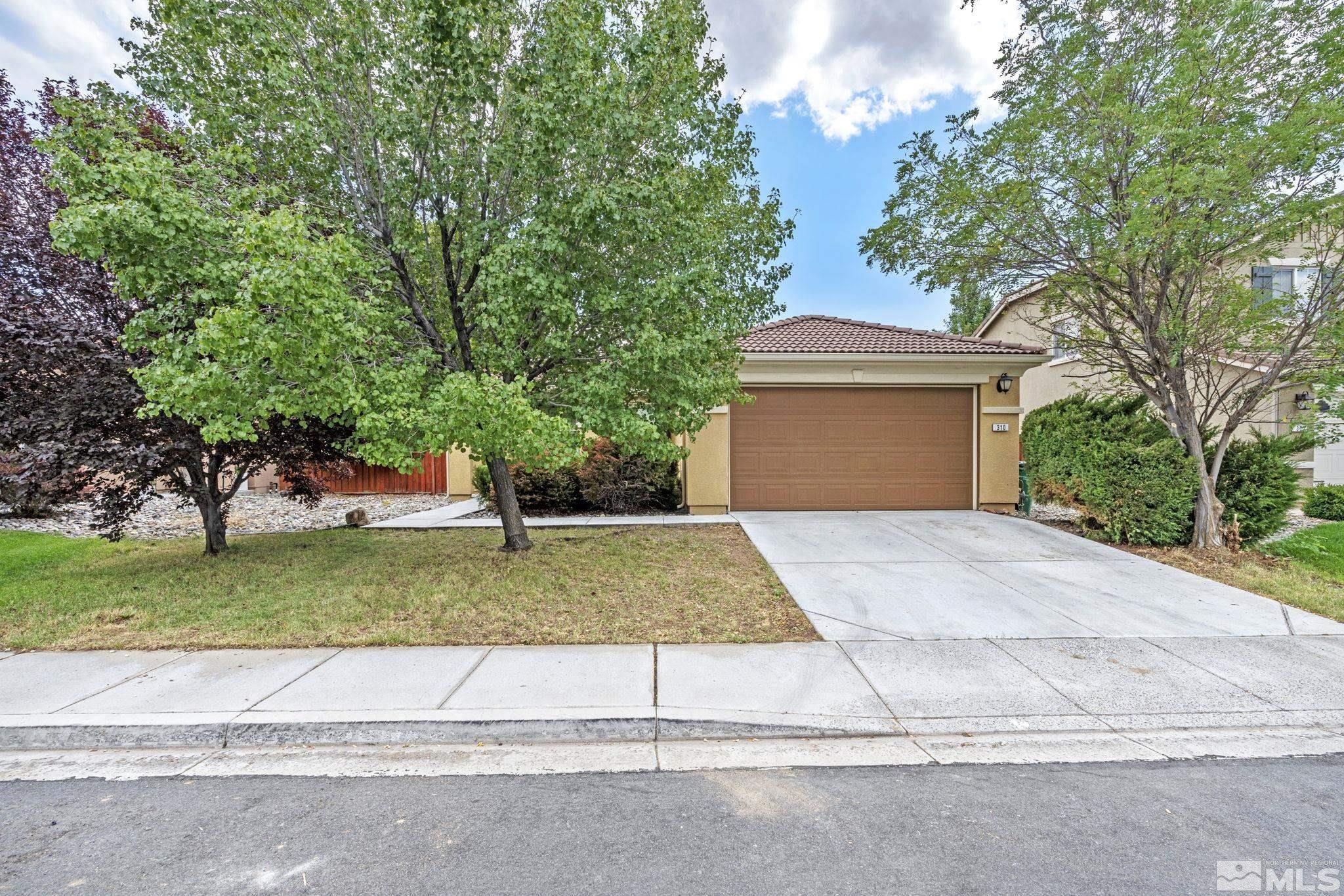 310 Pesaro Way Reno, NV 89521 - Photo 1 of 25 a house with yard and a trees