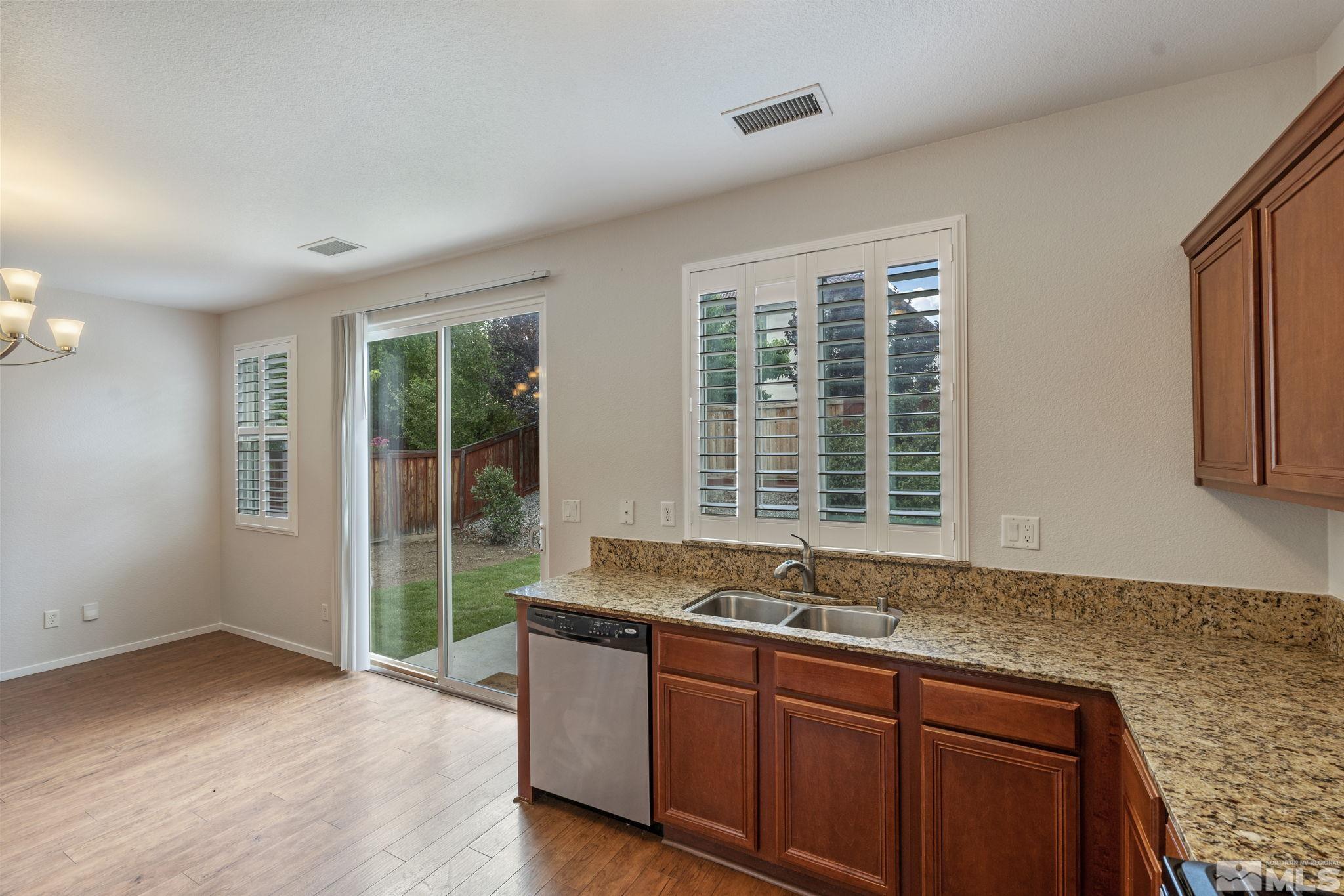 310 Pesaro Way Reno, NV 89521 - Photo 12 of 25 a living room with granite countertop furniture and fireplace