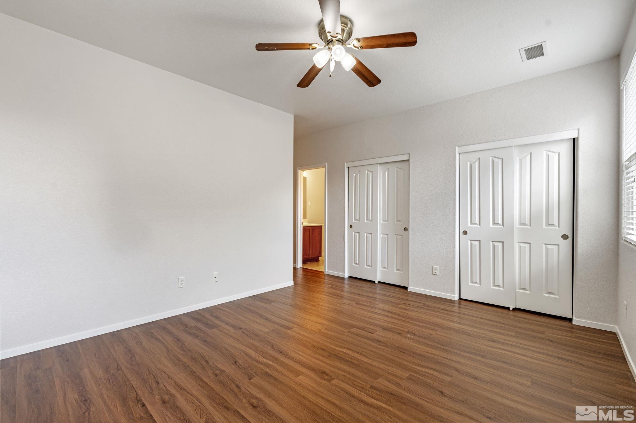 310 Pesaro Way Reno, NV 89521 - Photo 15 of 25 a view of empty room with wooden floor
