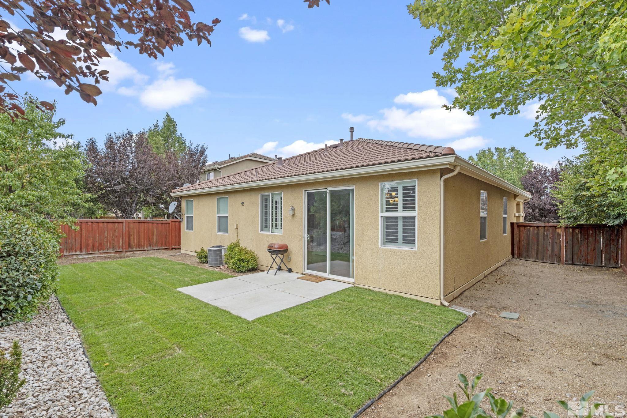 310 Pesaro Way Reno, NV 89521 - Photo 22 of 25 a view of a house with a yard and porch