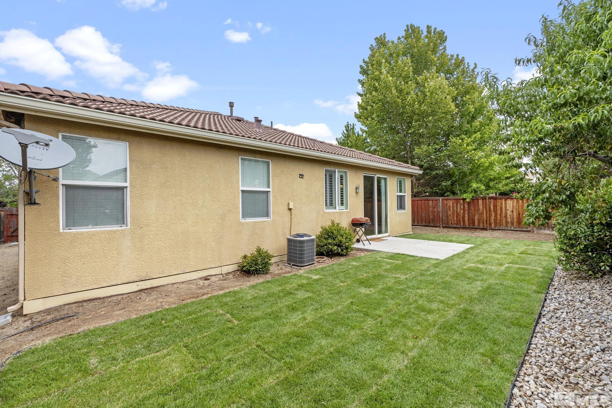 310 Pesaro Way Reno, NV 89521 - Photo 23 of 25 a front view of a house with garden