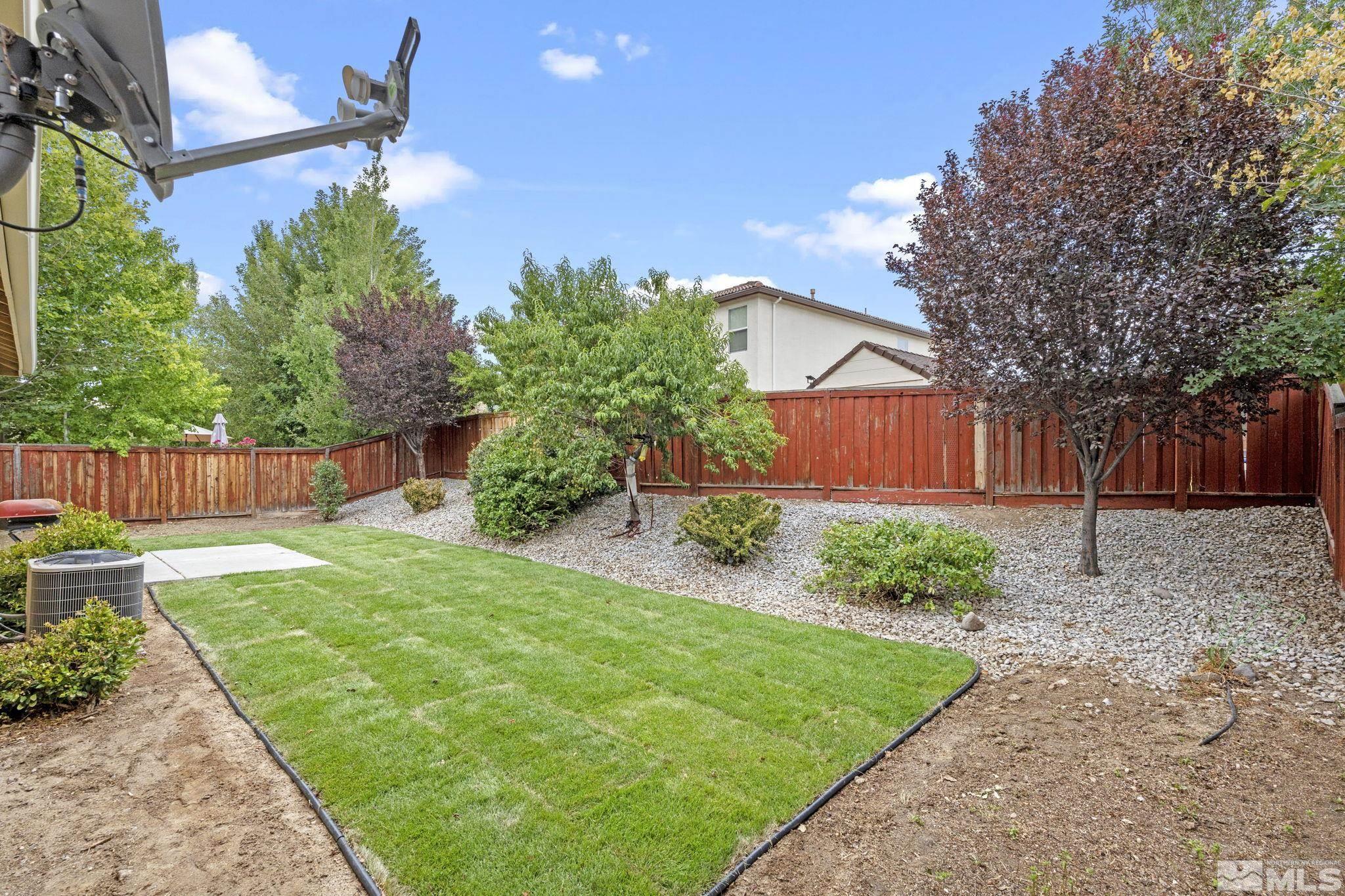 310 Pesaro Way Reno, NV 89521 - Photo 24 of 25 a front view of a house with garden