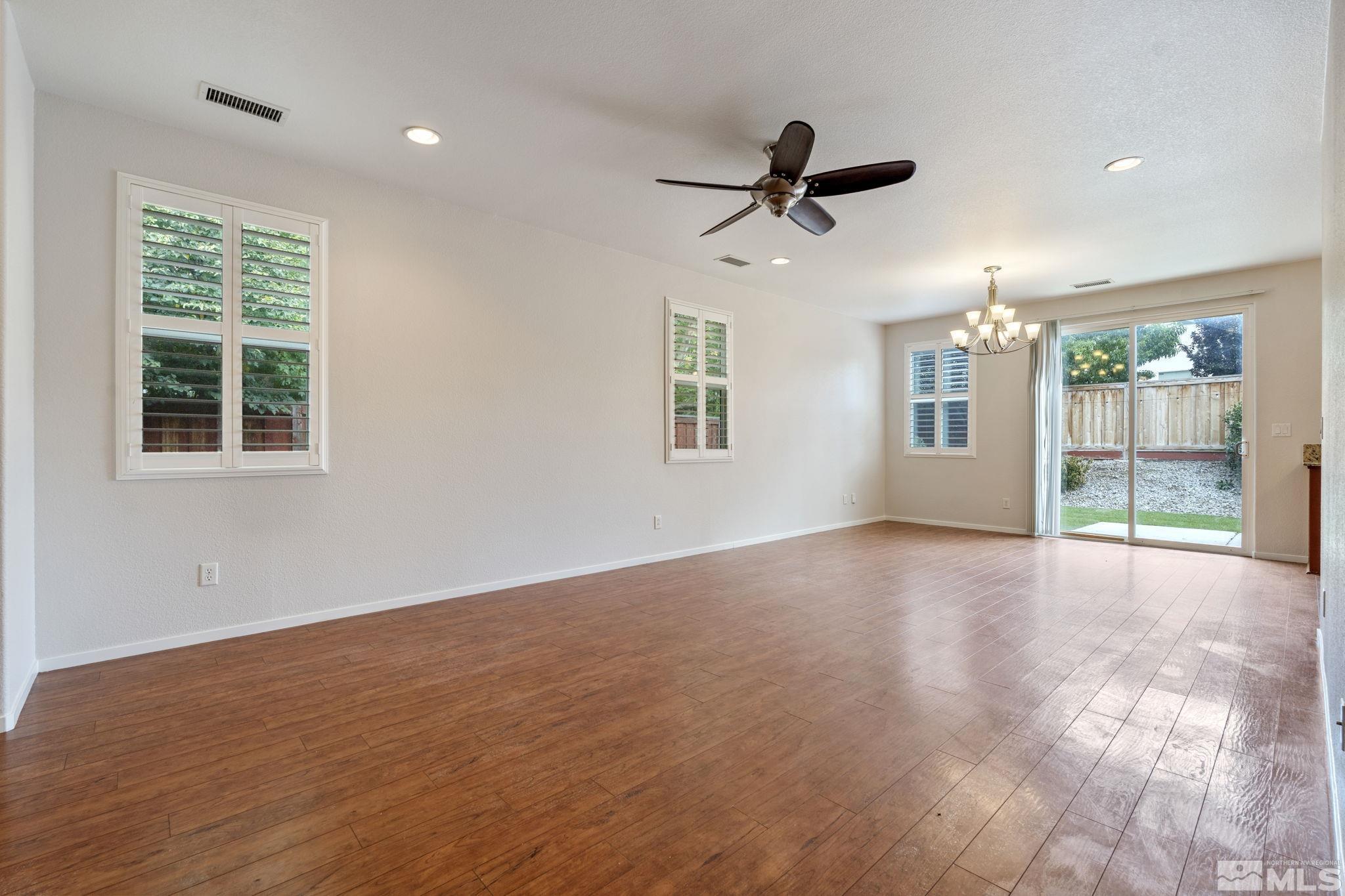 310 Pesaro Way Reno, NV 89521 - Photo 4 of 25 a view of a livingroom with a ceiling fan and window