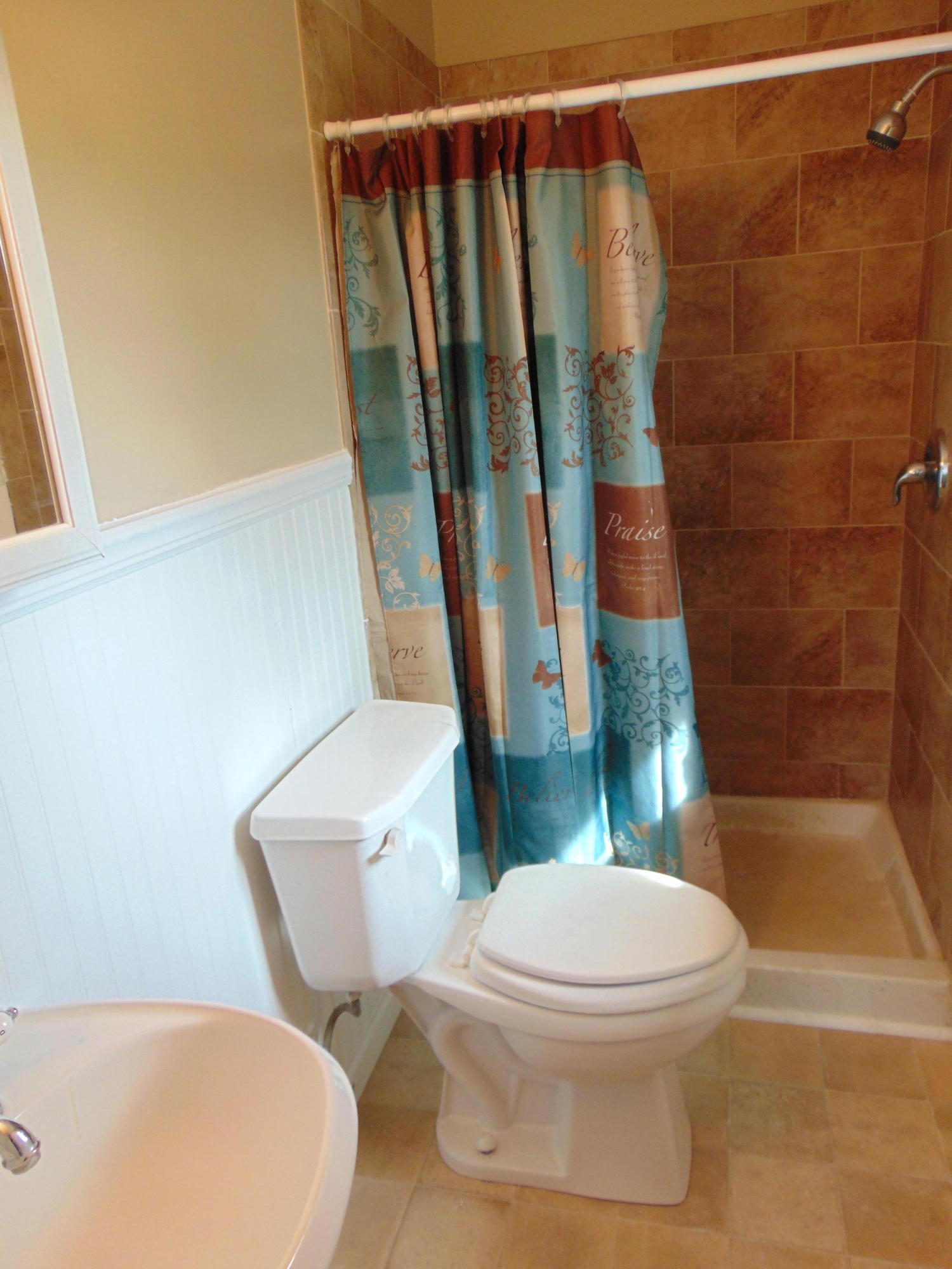 232 Cade Road Ten Mile, TN 37880 - Photo 14 of 35 a white toilet sitting next to a bath tub and a sink