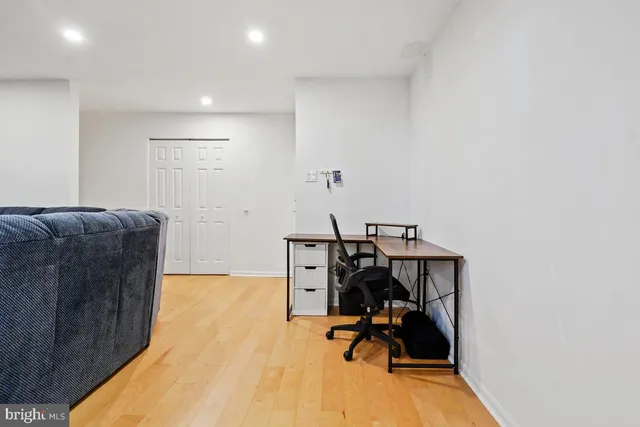 a view of workspace with chair and wooden floor