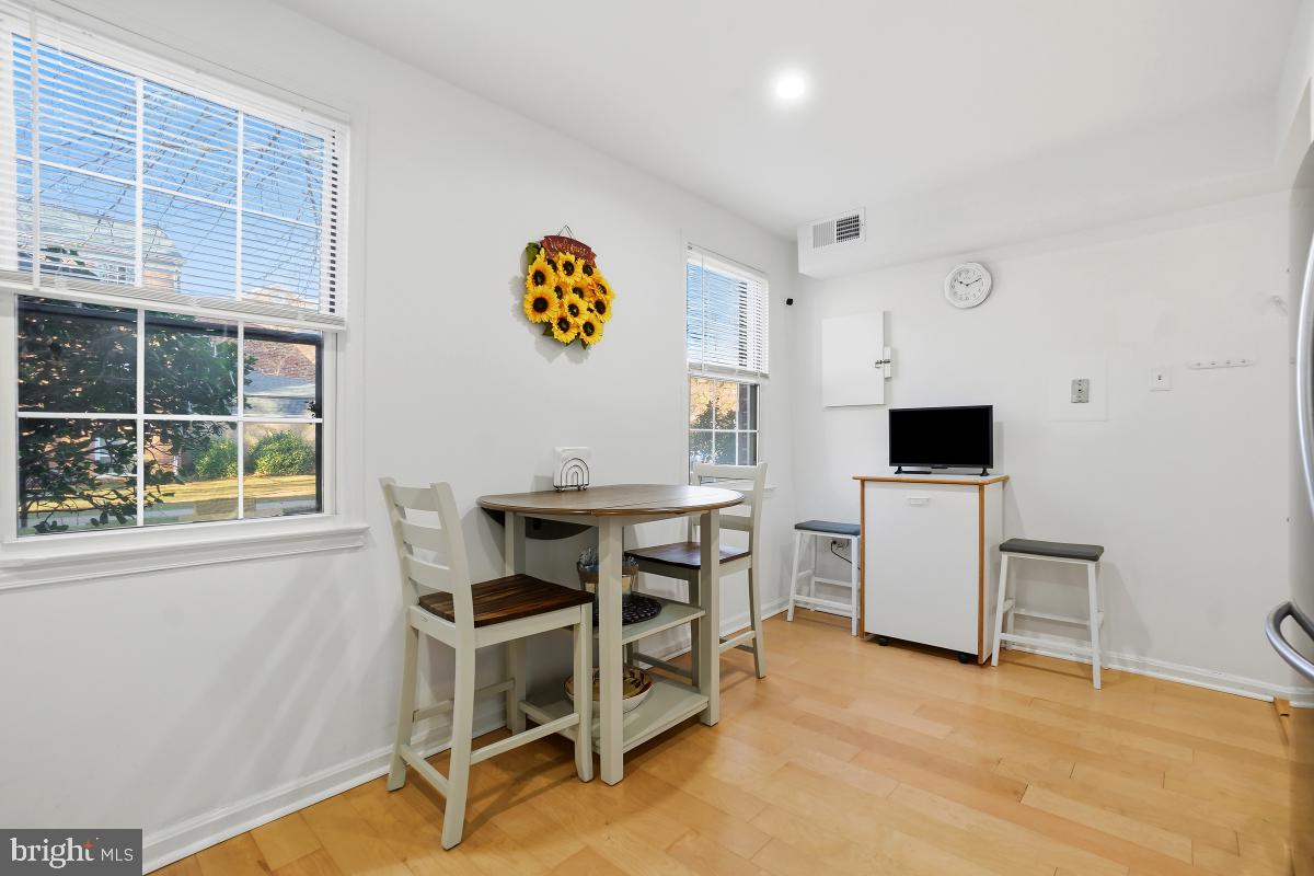 794 Quince Orchard Boulevard, Unit T2 Gaithersburg, MD 20878 - Photo 19 of 30 a view of a workspace with furniture and windows
