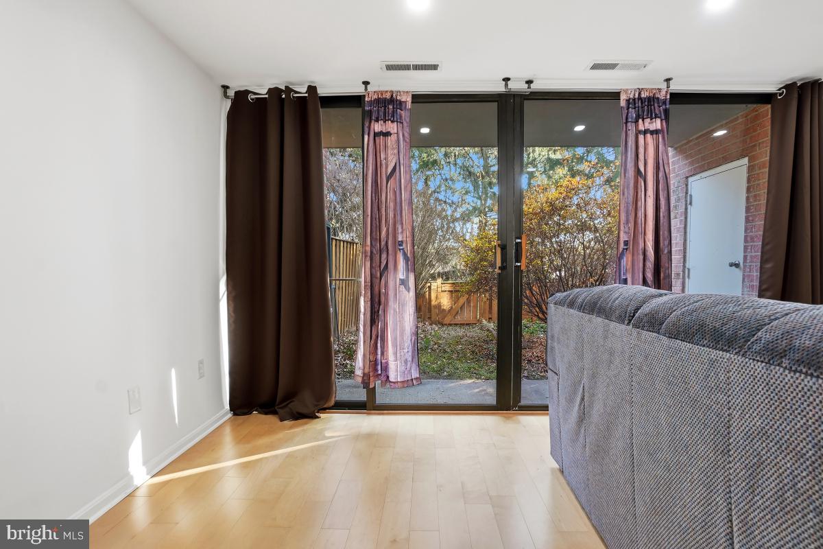 794 Quince Orchard Boulevard, Unit T2 Gaithersburg, MD 20878 - Photo 10 of 30 a view of a living room with a large window