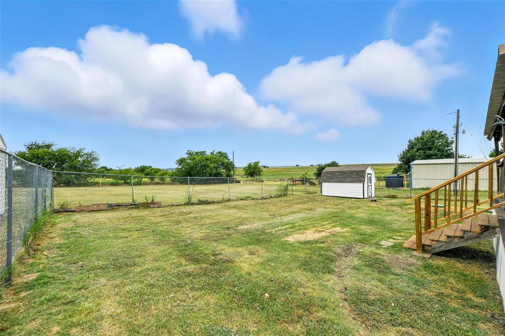 197 Pondview Drive Decatur, TX 76234 - Photo 25 of 28 a view of a lake with a big yard