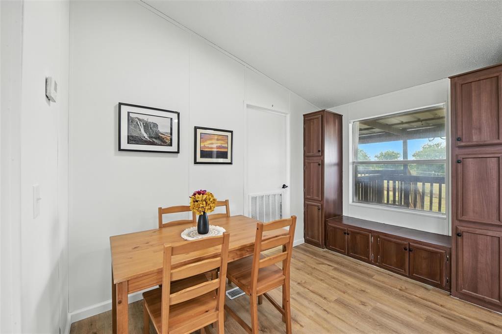 197 Pondview Drive Decatur, TX 76234 - Photo 7 of 28 a dining room with furniture and window