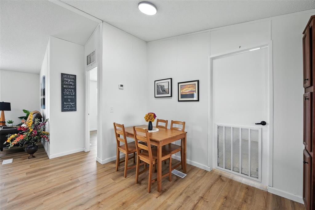 197 Pondview Drive Decatur, TX 76234 - Photo 8 of 28 a view of a room with wooden floor and furniture