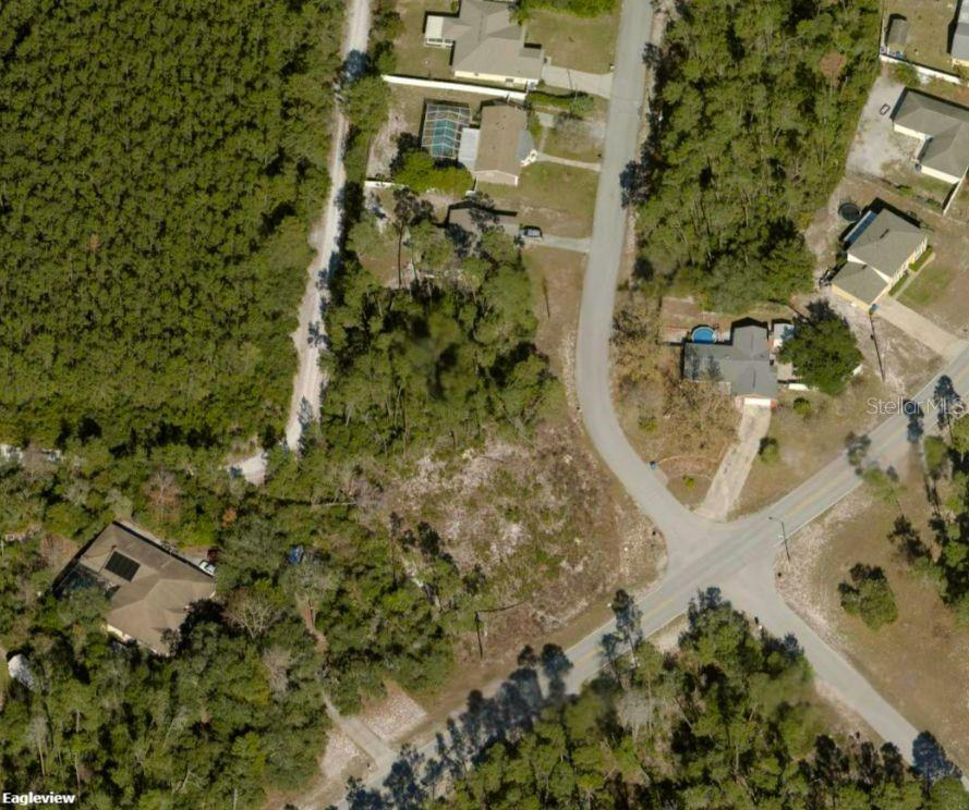 5417 Moongate Road Spring Hill, FL 34606 - Photo 4 of 4 a aerial view of a house with a yard