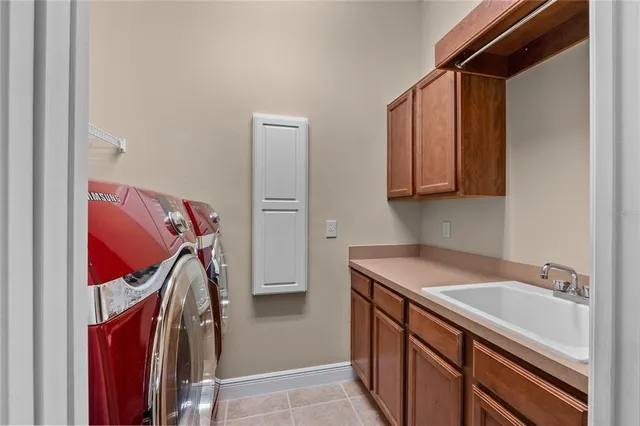 a spacious bathroom with double vanity and a large mirror