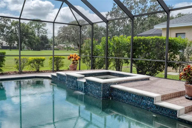 a view of a swimming pool with a patio