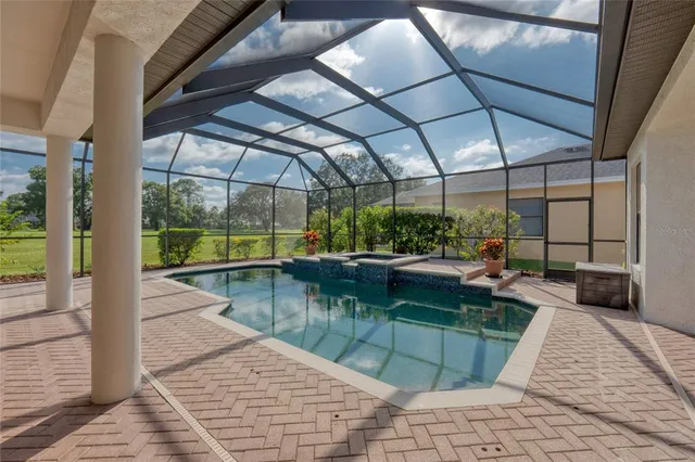 a view of a patio with a table and chairs