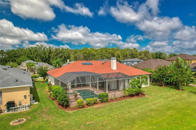 a view of a hallway with wooden floor and closet