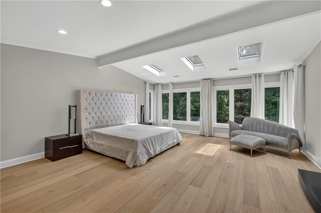 4610 West Morton Road Alpharetta, GA 30022 - Photo 29 of 53 a spacious bedroom with a bed and glass window