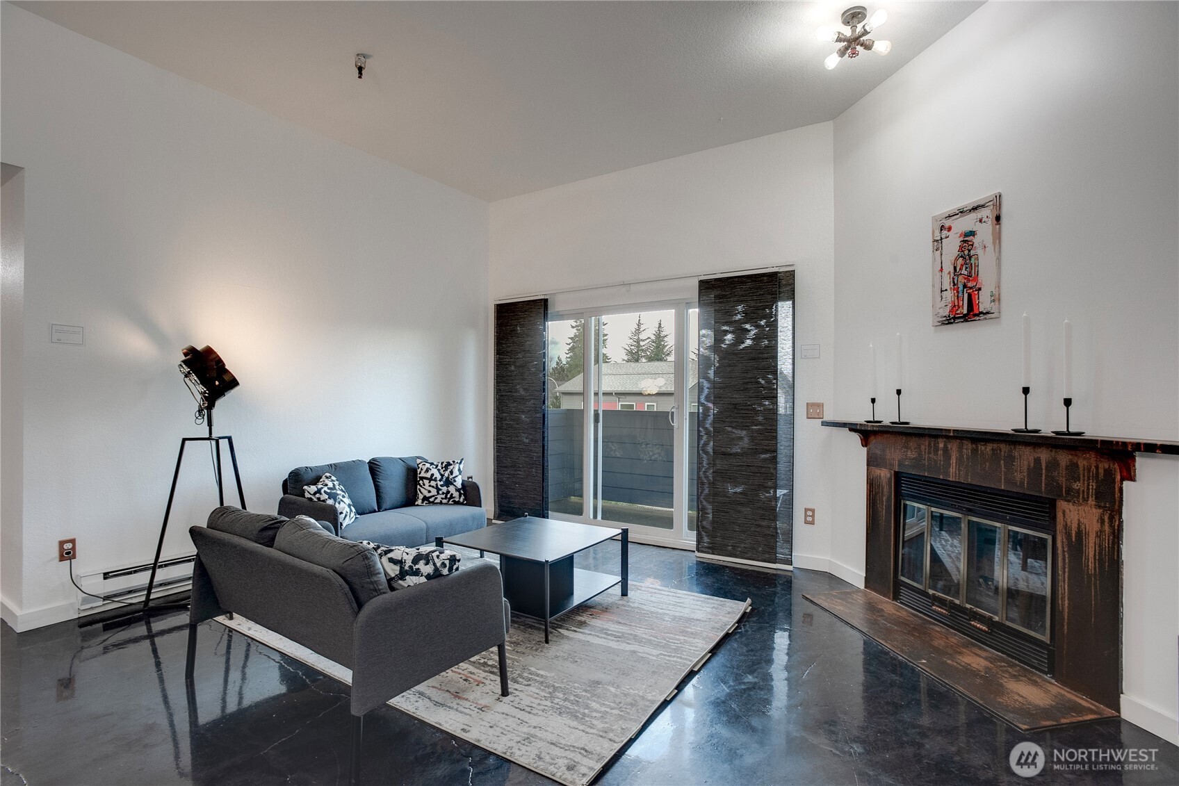 1100 Harrington Avenue Northeast, Unit 310 Renton, WA 98056 - Photo 12 of 40 a living room with furniture and a fireplace