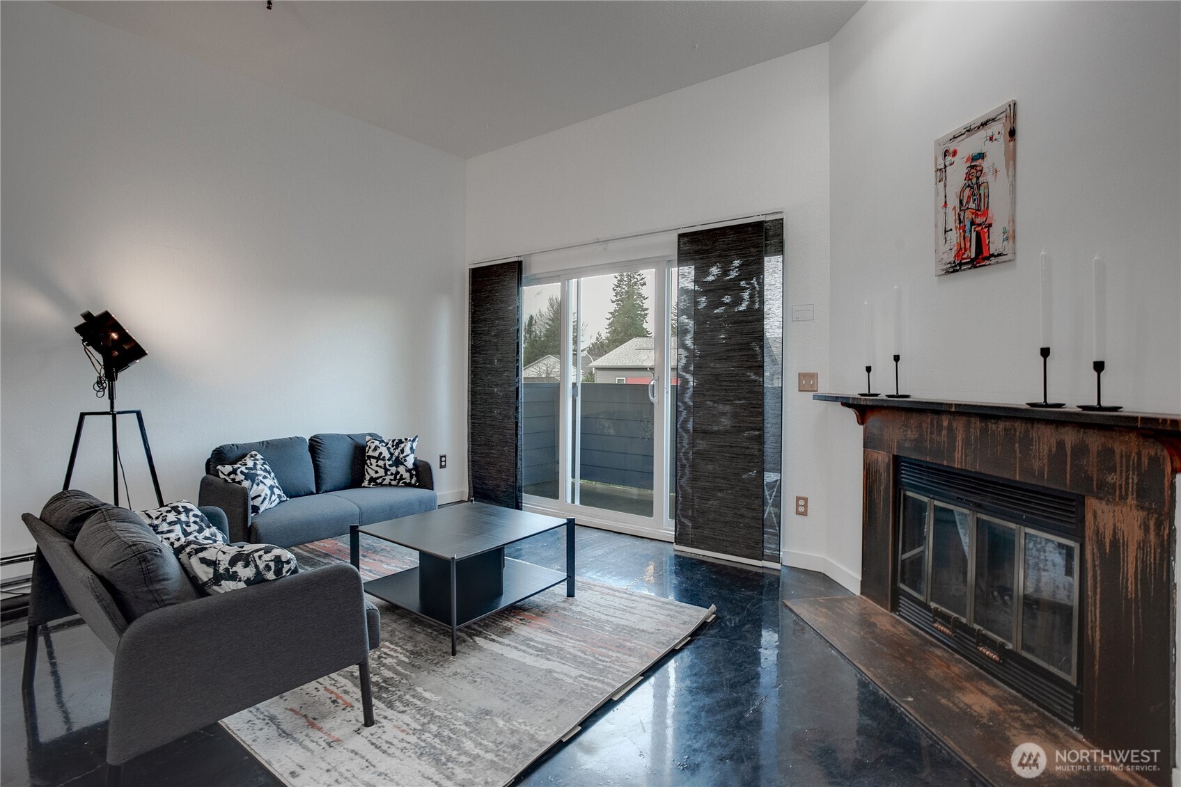 1100 Harrington Avenue Northeast, Unit 310 Renton, WA 98056 - Photo 13 of 40 a living room with furniture and a fireplace