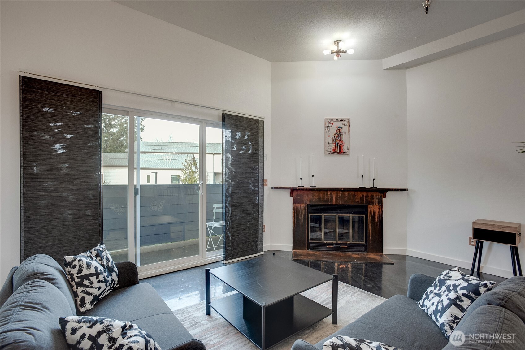 1100 Harrington Avenue Northeast, Unit 310 Renton, WA 98056 - Photo 16 of 40 a living room with furniture and a fireplace