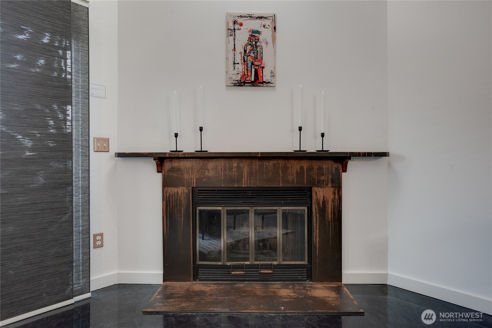 1100 Harrington Avenue Northeast, Unit 310 Renton, WA 98056 - Photo 17 of 40 a room with painting and a fireplace
