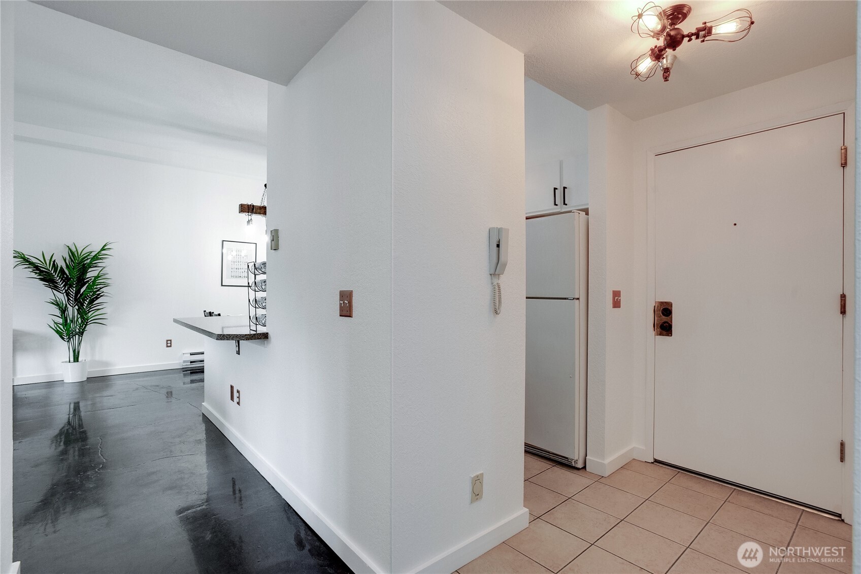 1100 Harrington Avenue Northeast, Unit 310 Renton, WA 98056 - Photo 2 of 40 a view of an entryway with wooden floor