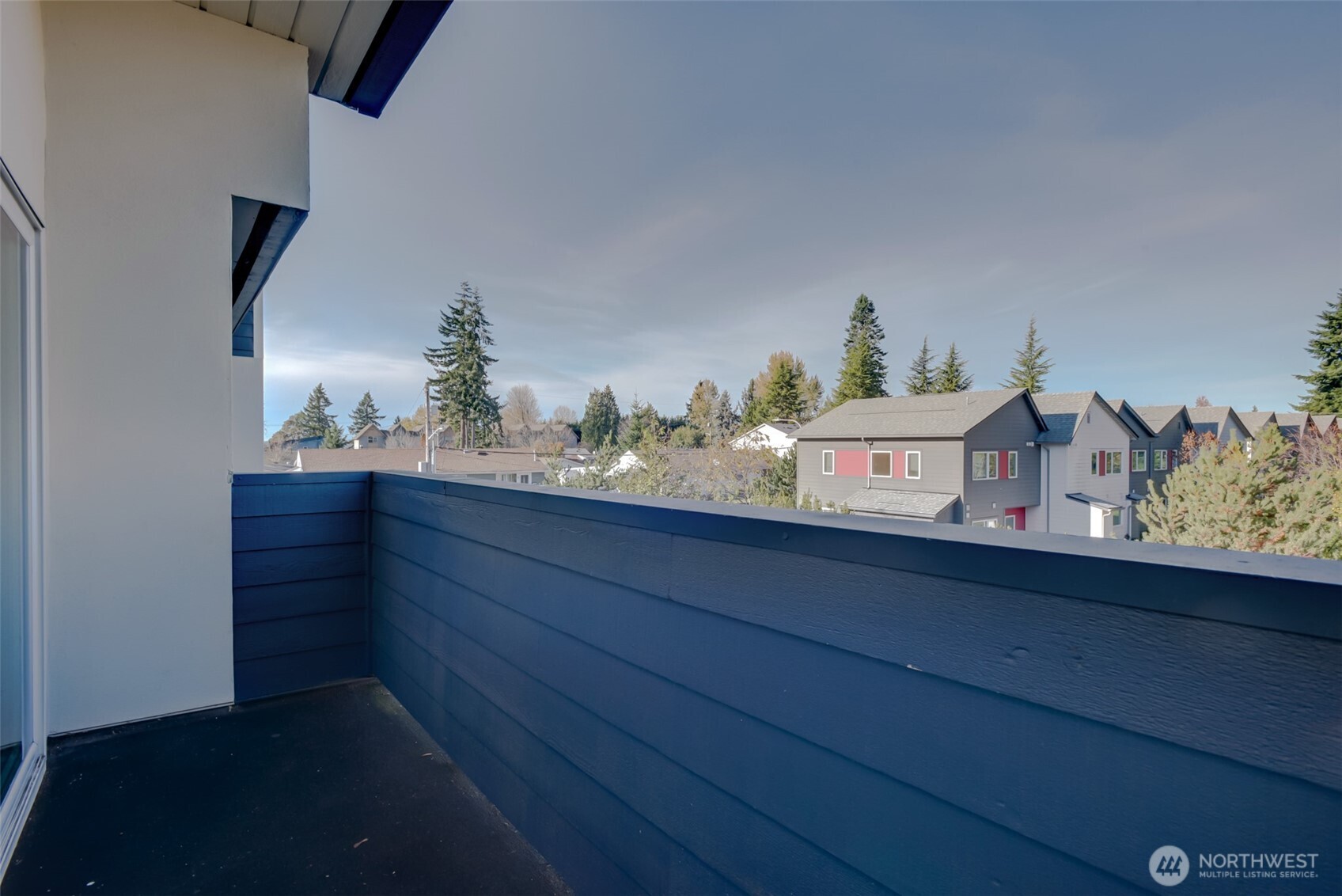1100 Harrington Avenue Northeast, Unit 310 Renton, WA 98056 - Photo 21 of 26 a room with a dresser and paintings on the wall