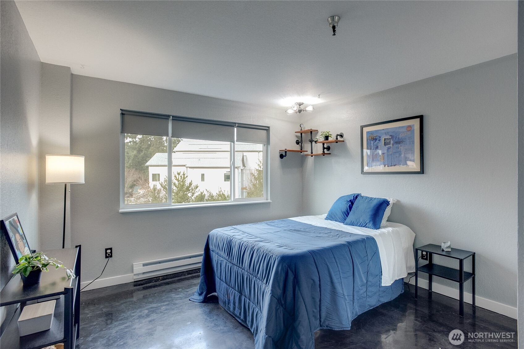 1100 Harrington Avenue Northeast, Unit 310 Renton, WA 98056 - Photo 24 of 40 a bedroom with a bed and a window