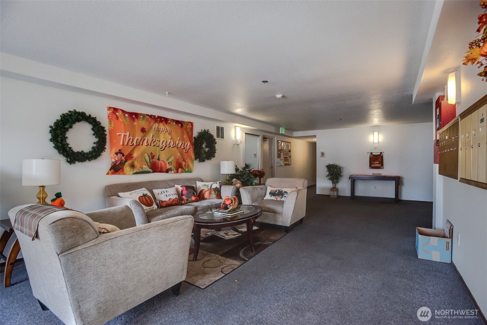 1100 Harrington Avenue Northeast, Unit 310 Renton, WA 98056 - Photo 25 of 26 a living room with furniture and a flat screen tv
