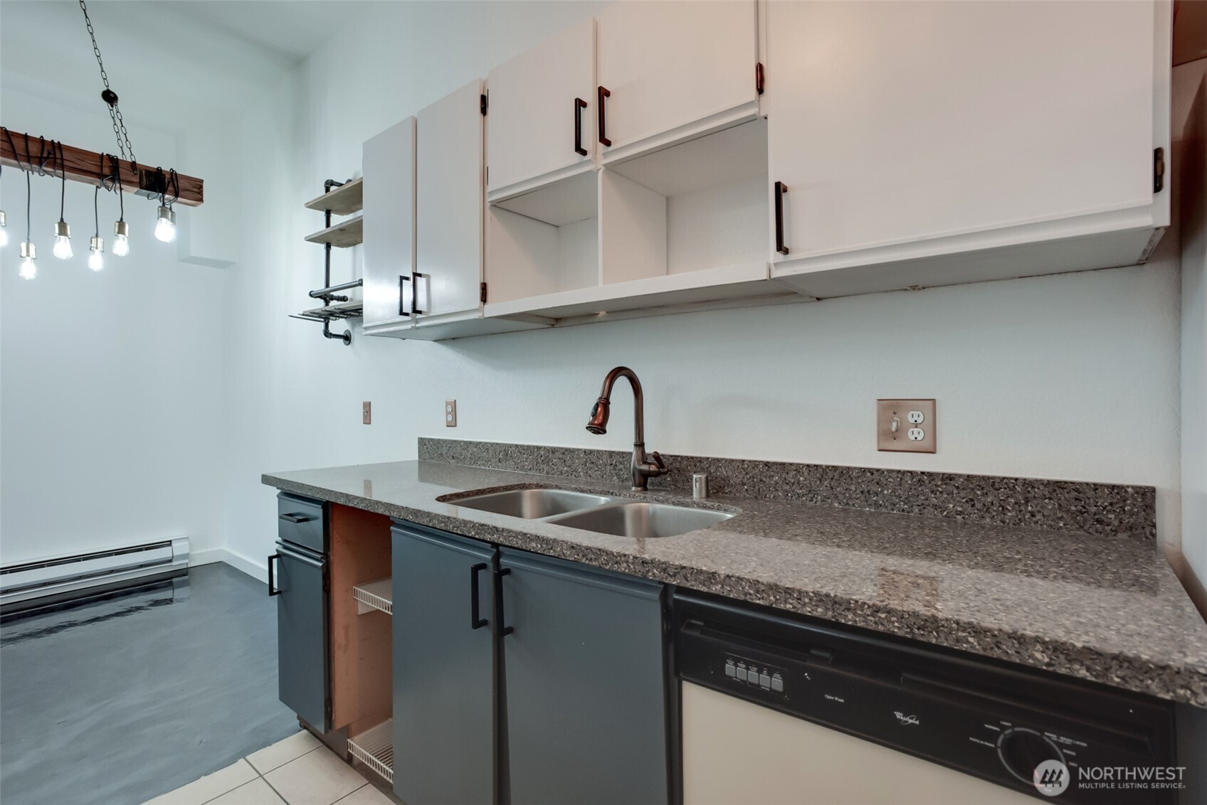 1100 Harrington Avenue Northeast, Unit 310 Renton, WA 98056 - Photo 5 of 26 a kitchen with stainless steel appliances granite countertop a sink and cabinets