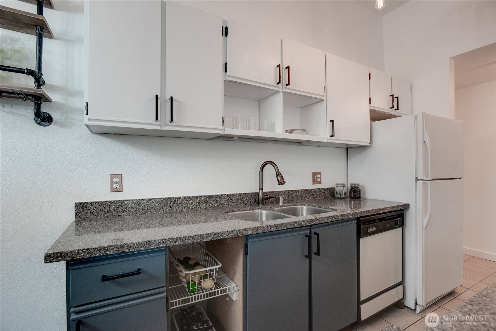 1100 Harrington Avenue Northeast, Unit 310 Renton, WA 98056 - Photo 6 of 40 a kitchen with stainless steel appliances granite countertop a sink and a white cabinets