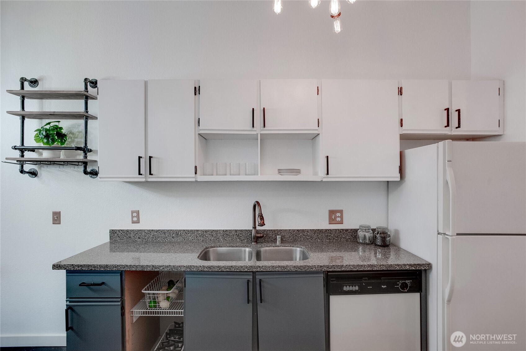 1100 Harrington Avenue Northeast, Unit 310 Renton, WA 98056 - Photo 7 of 40 a kitchen with stainless steel appliances granite countertop a sink a stove and a refrigerator