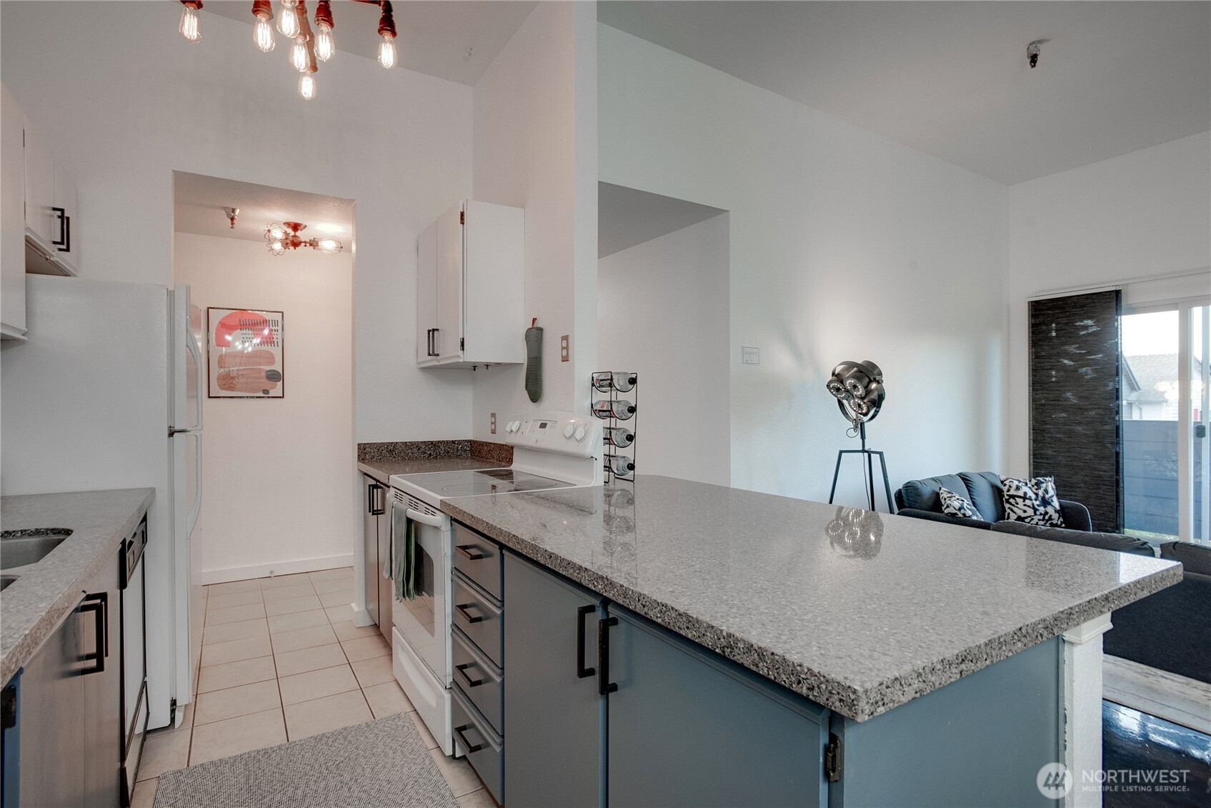 1100 Harrington Avenue Northeast, Unit 310 Renton, WA 98056 - Photo 8 of 40 a kitchen with a sink a counter space and stainless steel appliances