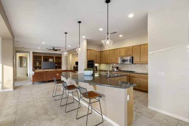 a kitchen with kitchen island granite countertop lots of counter top space