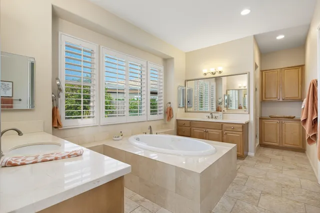 a bathroom with a sink and vanity