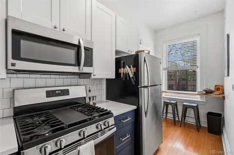 a kitchen with appliances and cabinets