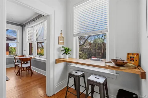 a view of a dining room with furniture window and outside view