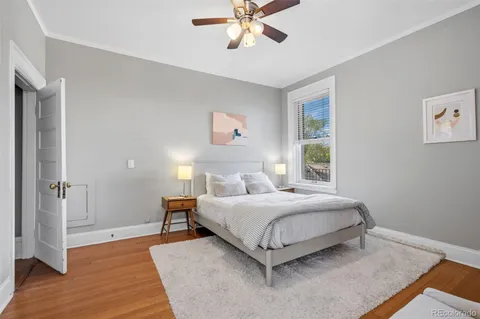 a a bedroom with a bed and a window