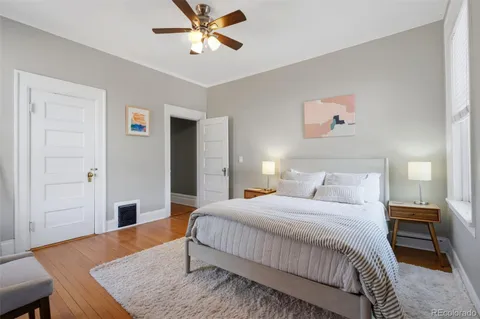 a bedroom with a bed and a table in it