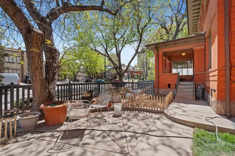 a view of a patio with two chairs and a table
