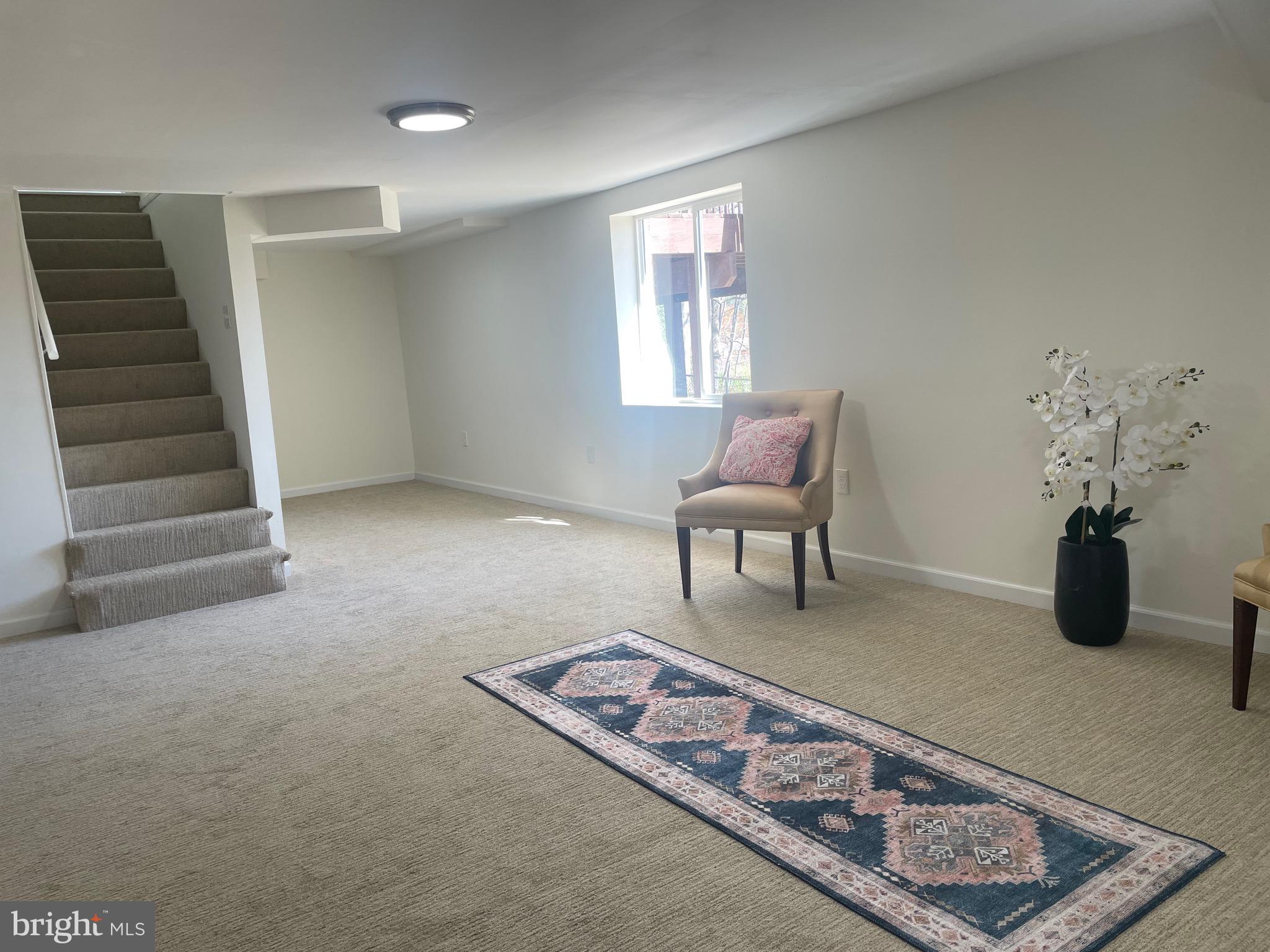 6107 Buckler Road Clinton, MD 20735 - Photo 25 of 45 a living room with furniture and a wooden floor
