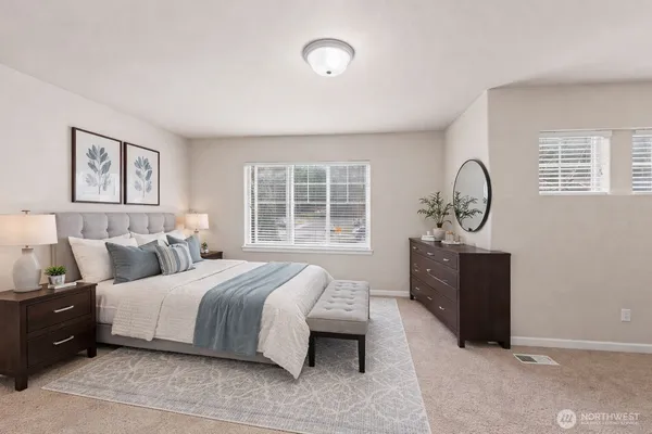 a bedroom with bed and window