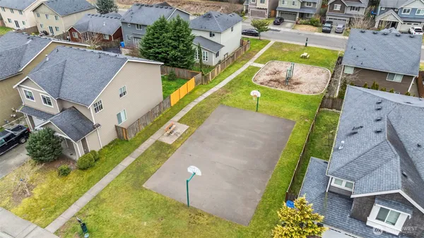 an aerial view of a house with a swimming pool