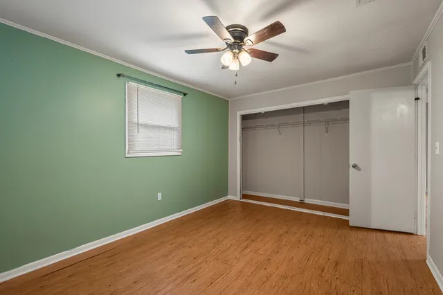 a view of room with window and ceiling fan