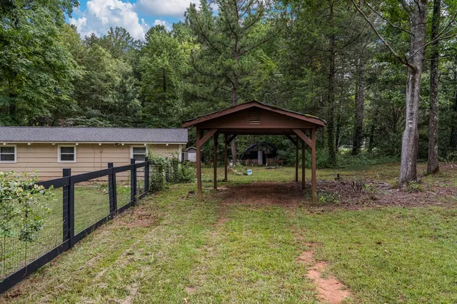 a view of a wooden deck with a yard